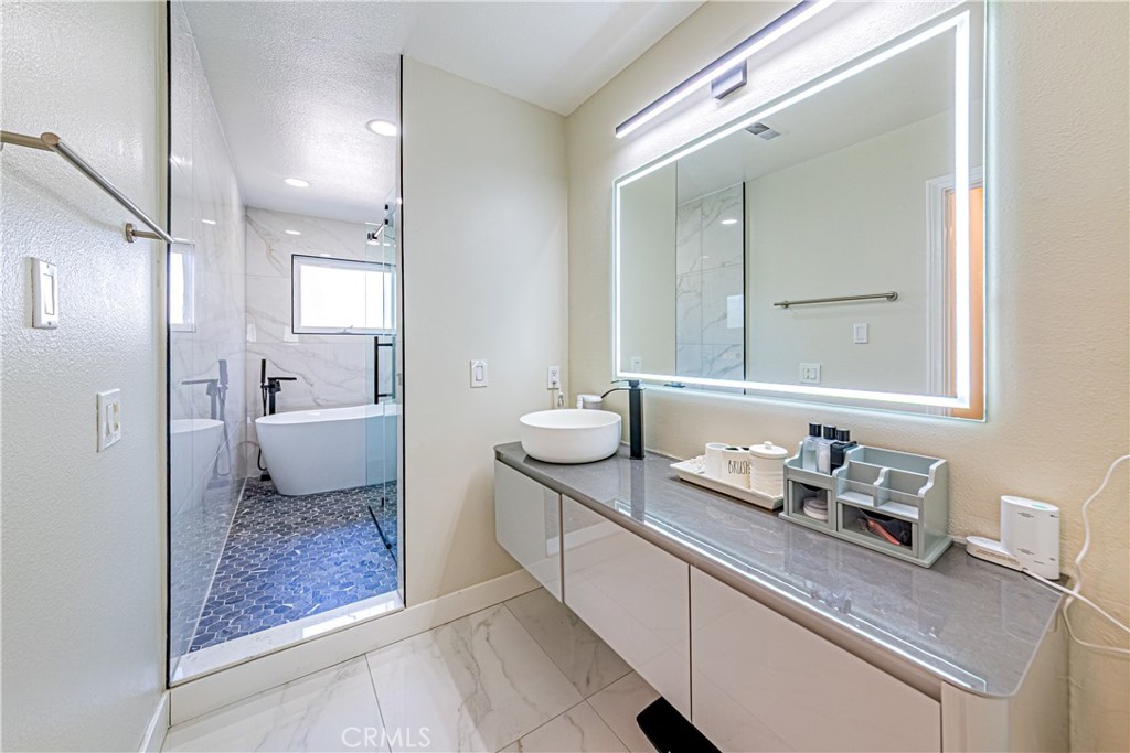 774 Stephens Avenue Fullerton, CA 92833 - Photo 23 of 53 a en suite bathroom with a granite countertop sink and a mirror