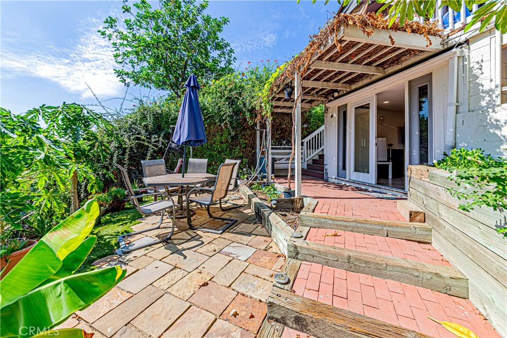 774 Stephens Avenue Fullerton, CA 92833 - Photo 38 of 53 a view of a chair and tables in the patio in front of house