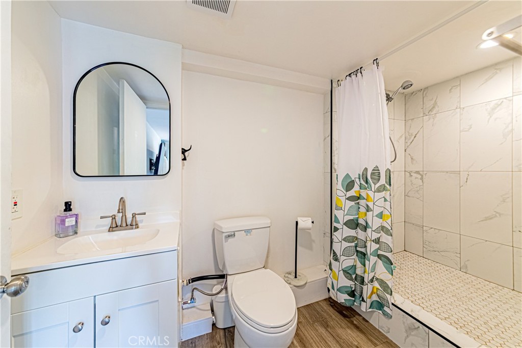 774 Stephens Avenue Fullerton, CA 92833 - Photo 40 of 53 a bathroom with a toilet a sink and shower