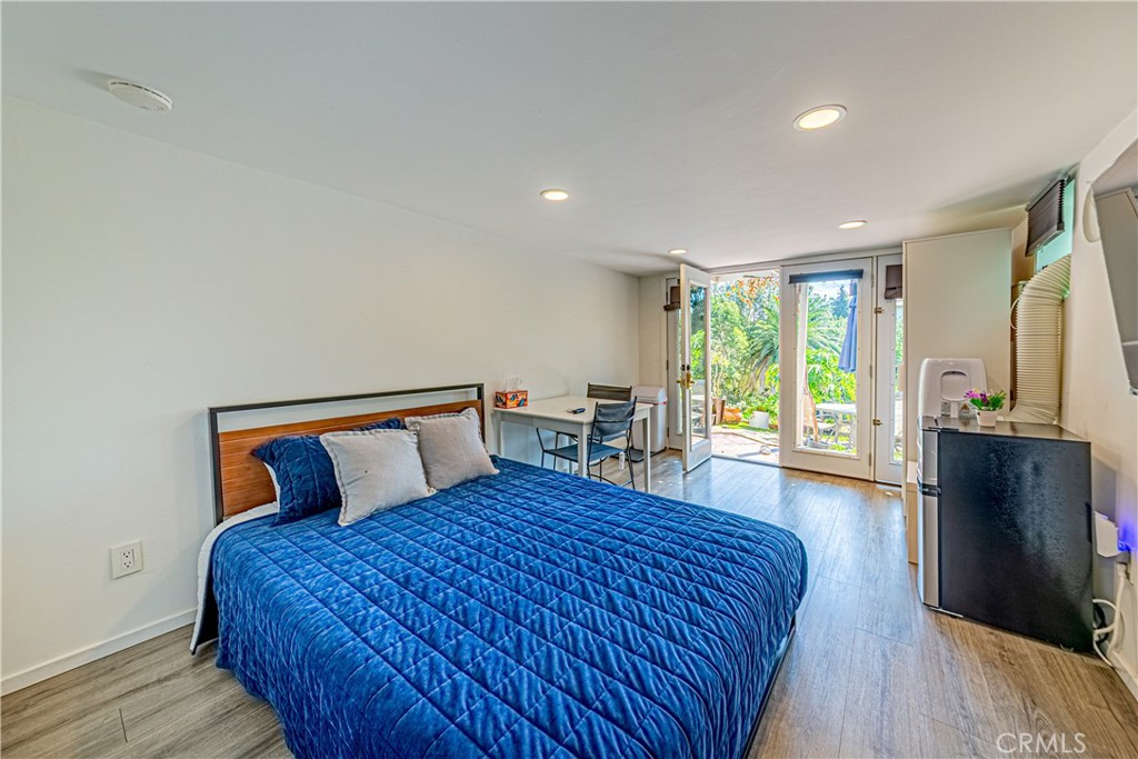 774 Stephens Avenue Fullerton, CA 92833 - Photo 41 of 53 a bedroom with a large bed and a flat tv screen on a dresser