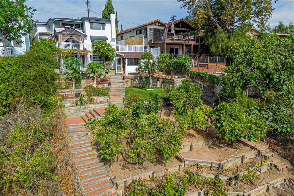 774 Stephens Avenue Fullerton, CA 92833 - Photo 50 of 53 a aerial view of a house with a yard and fountain in middle