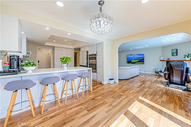 a kitchen with stainless steel appliances granite countertop a refrigerator and microwave