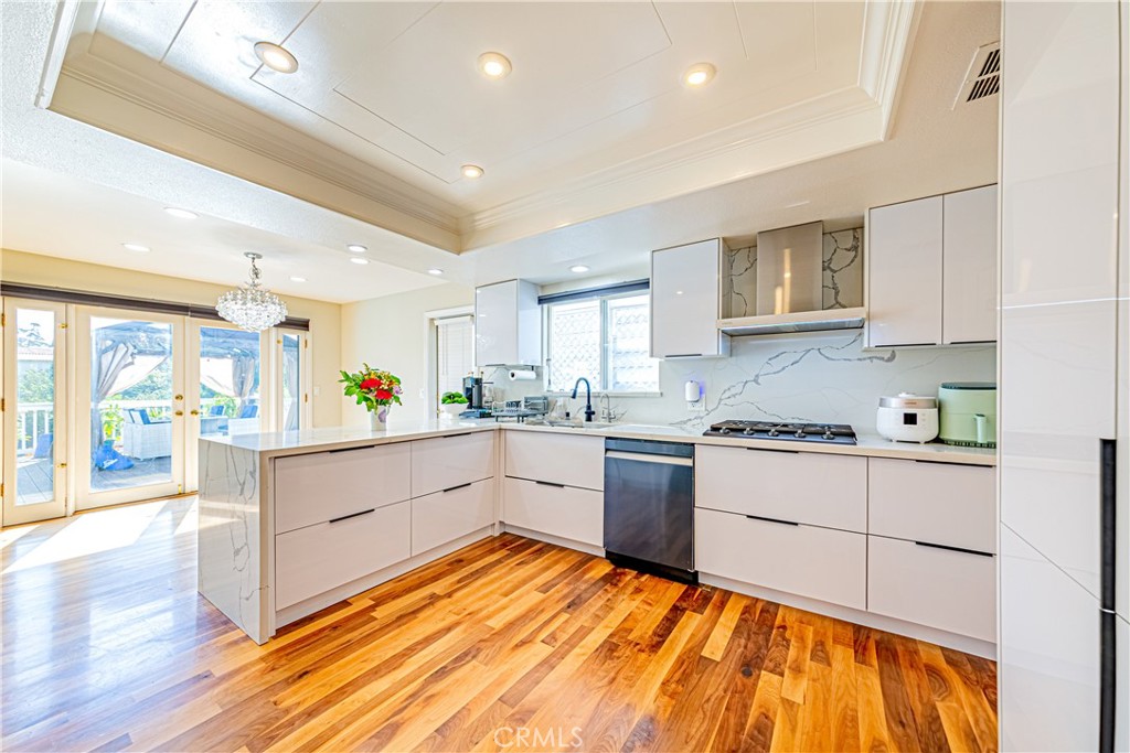774 Stephens Avenue Fullerton, CA 92833 - Photo 10 of 53 a kitchen with stainless steel appliances granite countertop a stove and white cabinets