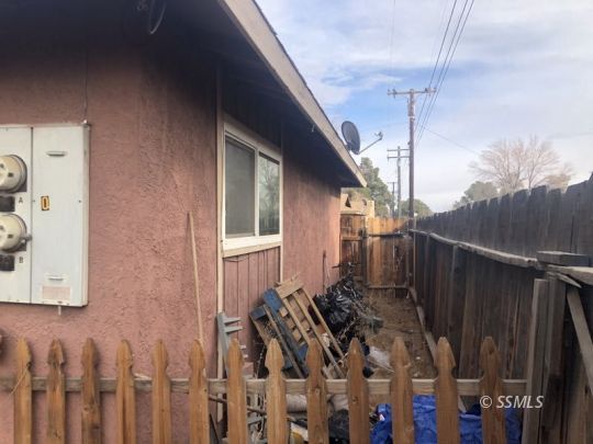 125 South Broadway Street Ridgecrest, CA 93555 - Photo 16 of 24 a view of a house with a wooden fence