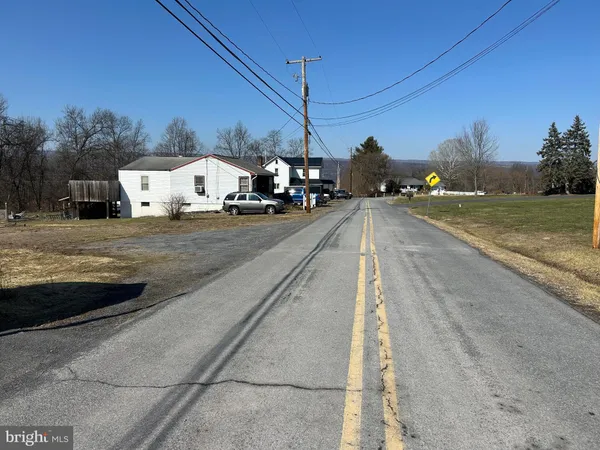 a view of a city street from a house