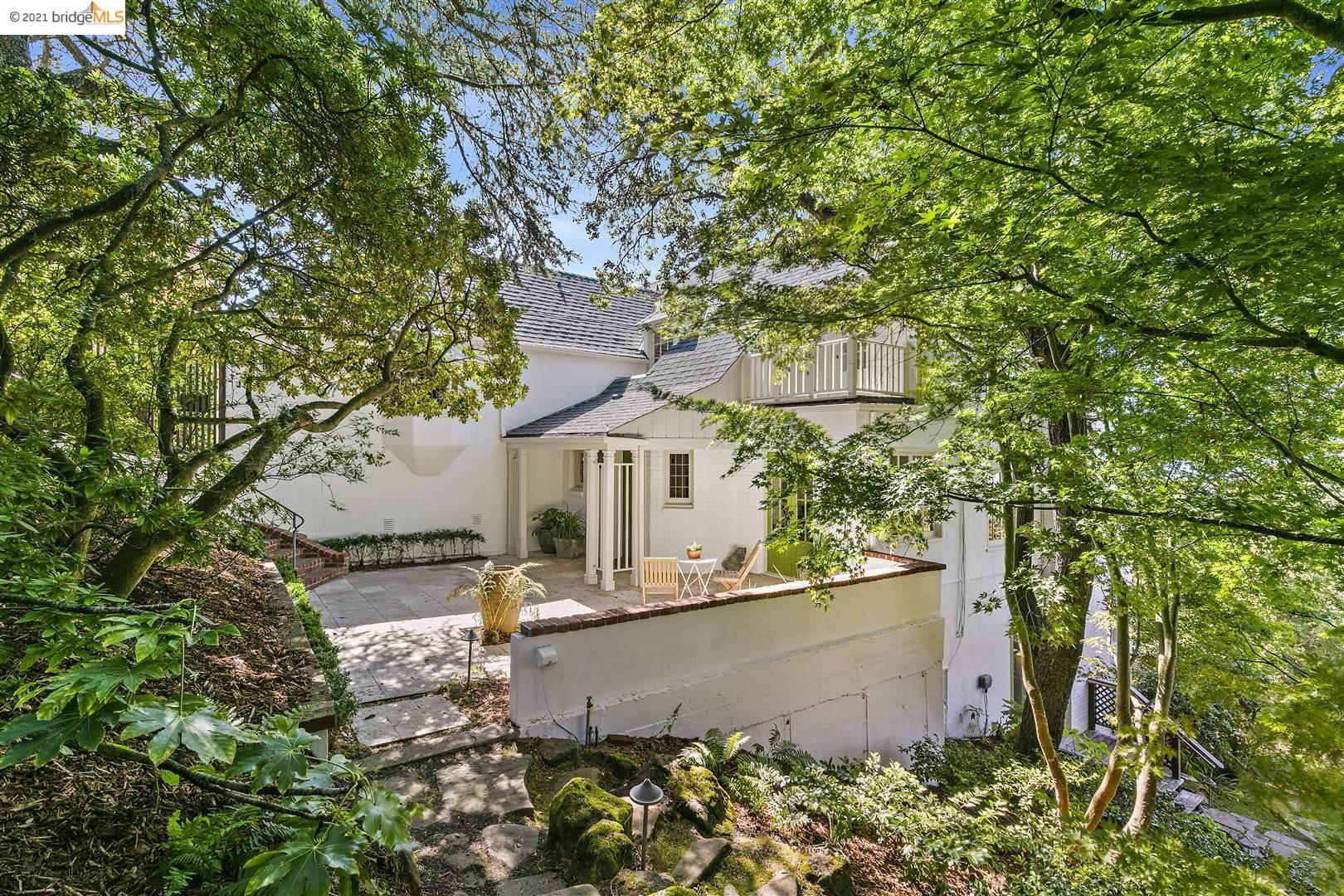 front view of a house with a tree