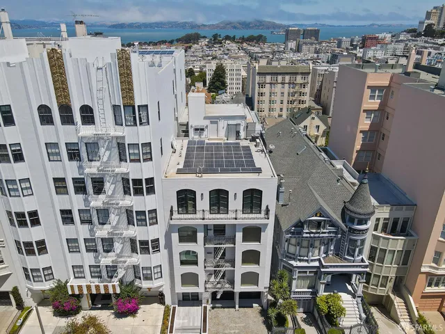 an aerial view of multi story residential apartment building