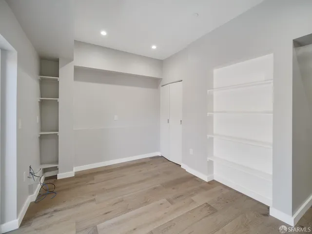an empty room with wooden floor