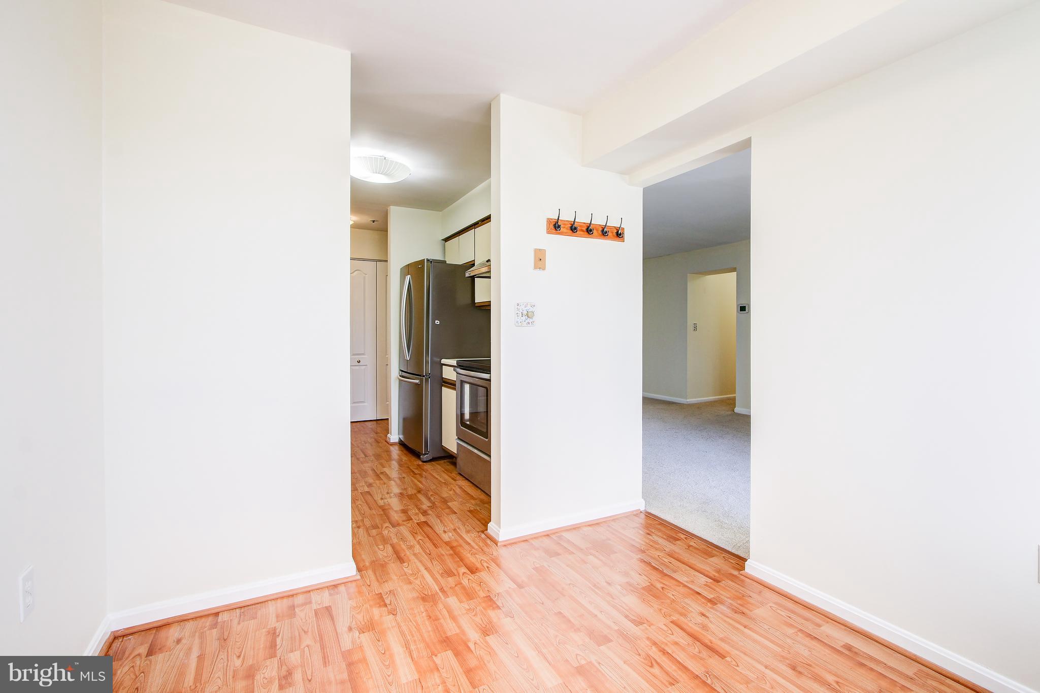 8371 Montgomery Run Road, Unit H Ellicott City, MD 21043 - Photo 13 of 33 Dining Room New Flooring