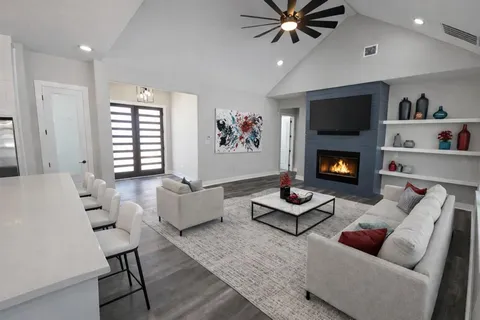a living room with furniture and a fireplace