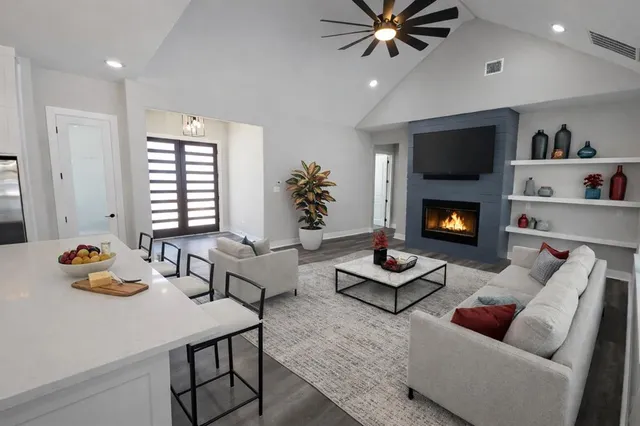 a living room with furniture and a fireplace