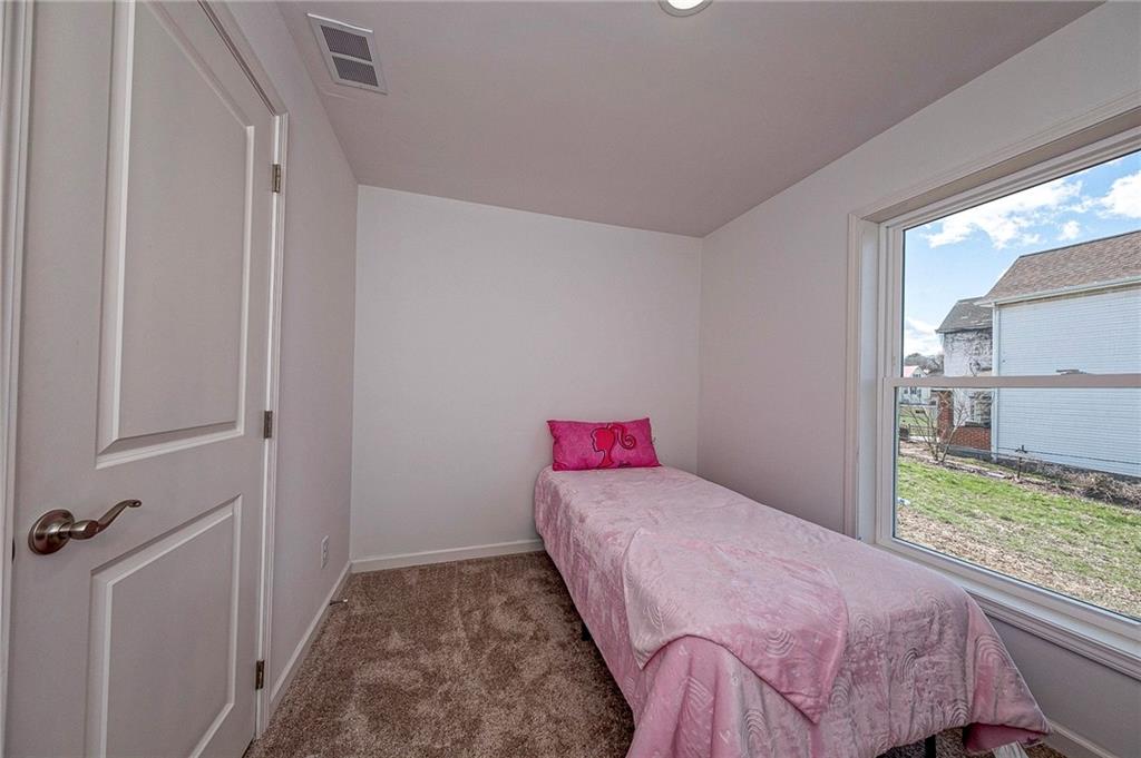 448 Motheral Avenue Monessen, PA 15062 - Photo 11 of 20 a bedroom with a bed and a window