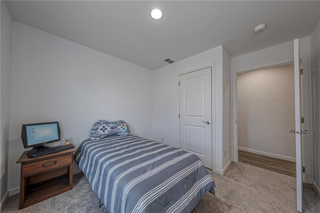 448 Motheral Avenue Monessen, PA 15062 - Photo 15 of 20 a bedroom with a bed and a tv