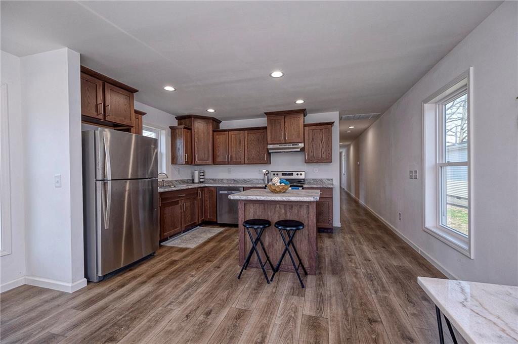 448 Motheral Avenue Monessen, PA 15062 - Photo 6 of 20 a kitchen with a refrigerator a sink and cabinets