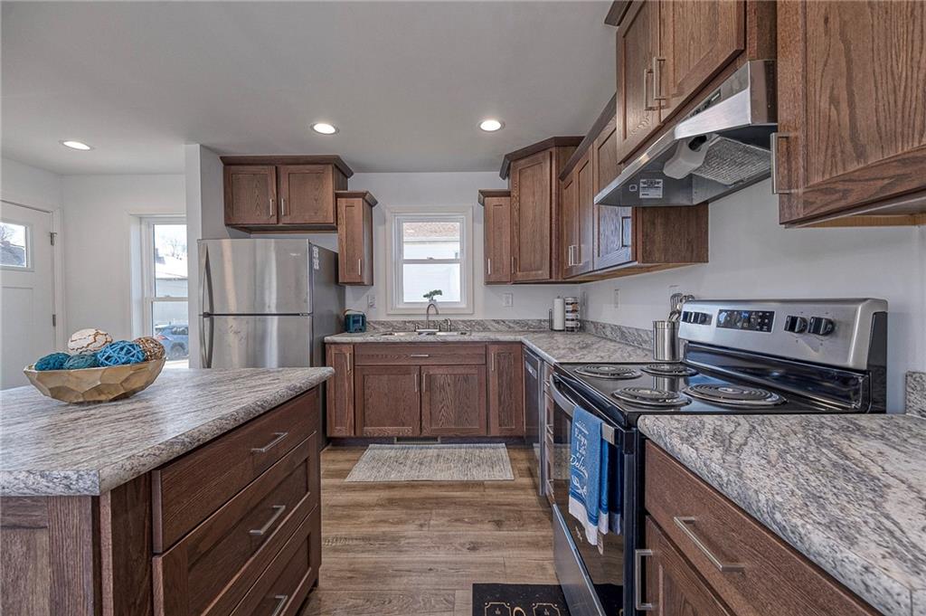 448 Motheral Avenue Monessen, PA 15062 - Photo 7 of 20 a kitchen with granite countertop a sink stove and refrigerator
