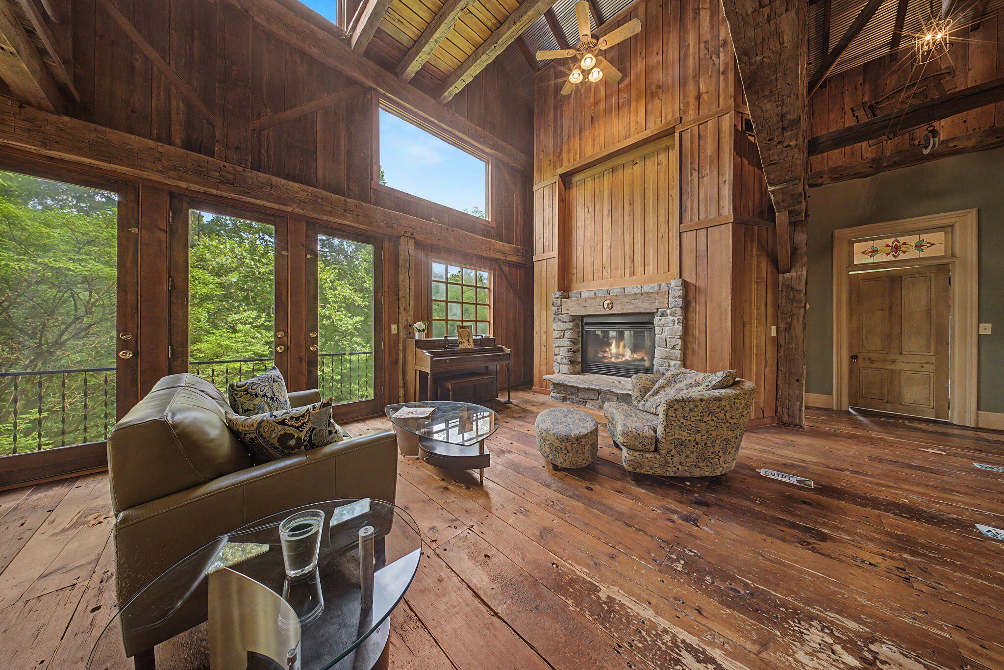 9766 Sullivan Road Union, KY 41091 - Photo 2 of 50 The rustic pine floors and wood beams came from a late 1800's hay press barn. The rock fireplace was laid by a local sculptor and stone mason: Richard Young.