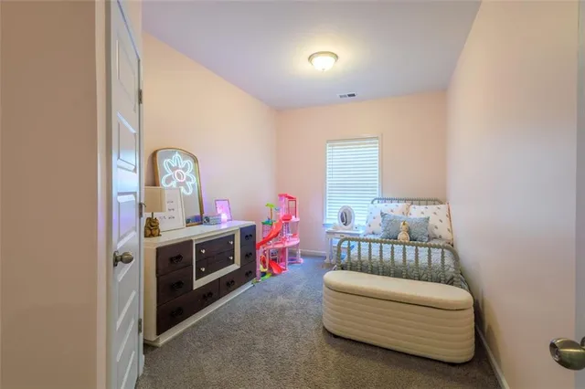 a bedroom with furniture and a couch