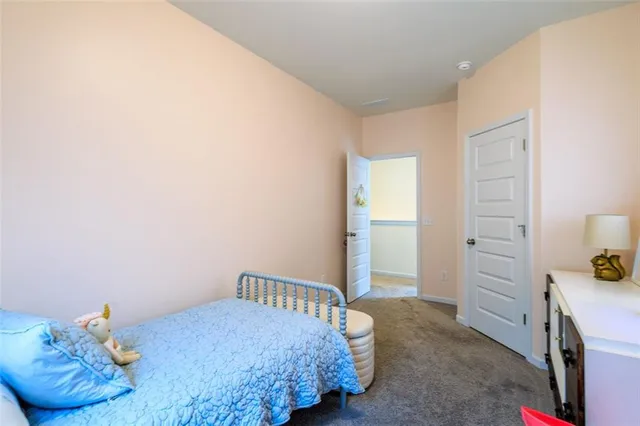 a bedroom with a bed and cabinets