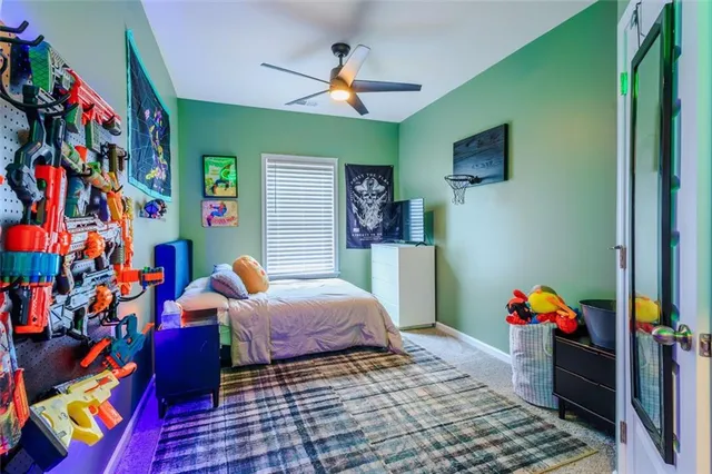 a bed room with a bed and a chandelier