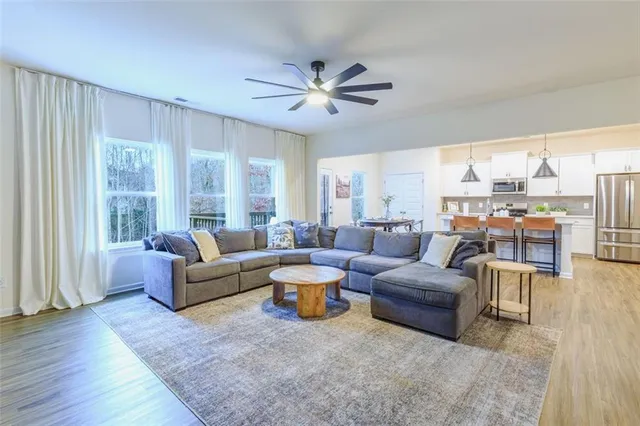a living room with furniture and a large window