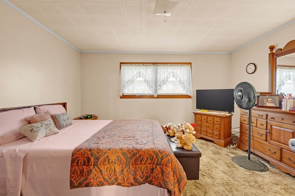 54 Airport Road Fitchburg, MA 01420 - Photo 11 of 38 a bedroom with a bed and dresser