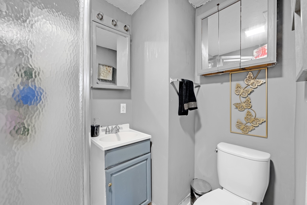 54 Airport Road Fitchburg, MA 01420 - Photo 15 of 38 a bathroom with a toilet sink and mirror