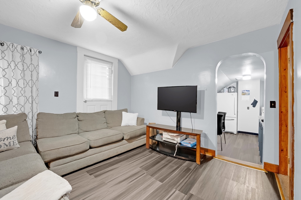 54 Airport Road Fitchburg, MA 01420 - Photo 16 of 38 a living room with furniture and a flat screen tv