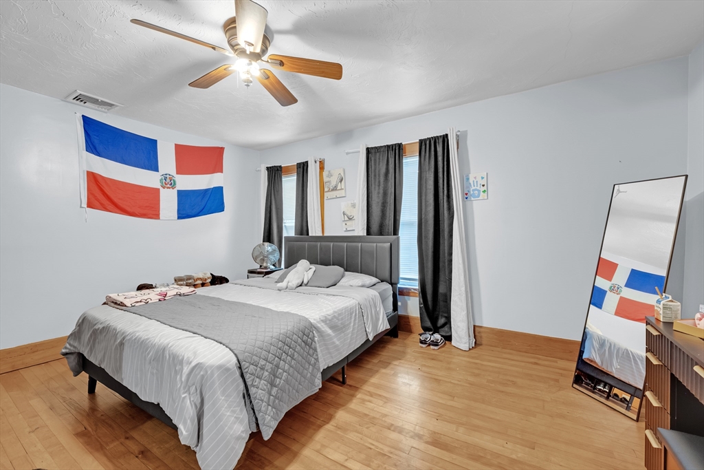 54 Airport Road Fitchburg, MA 01420 - Photo 19 of 38 a bedroom with a bed and a flat screen tv