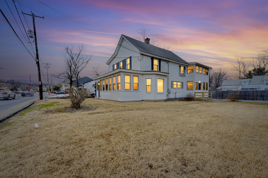 54 Airport Road Fitchburg, MA 01420 - Photo 23 of 38 a front view of a house with a yard