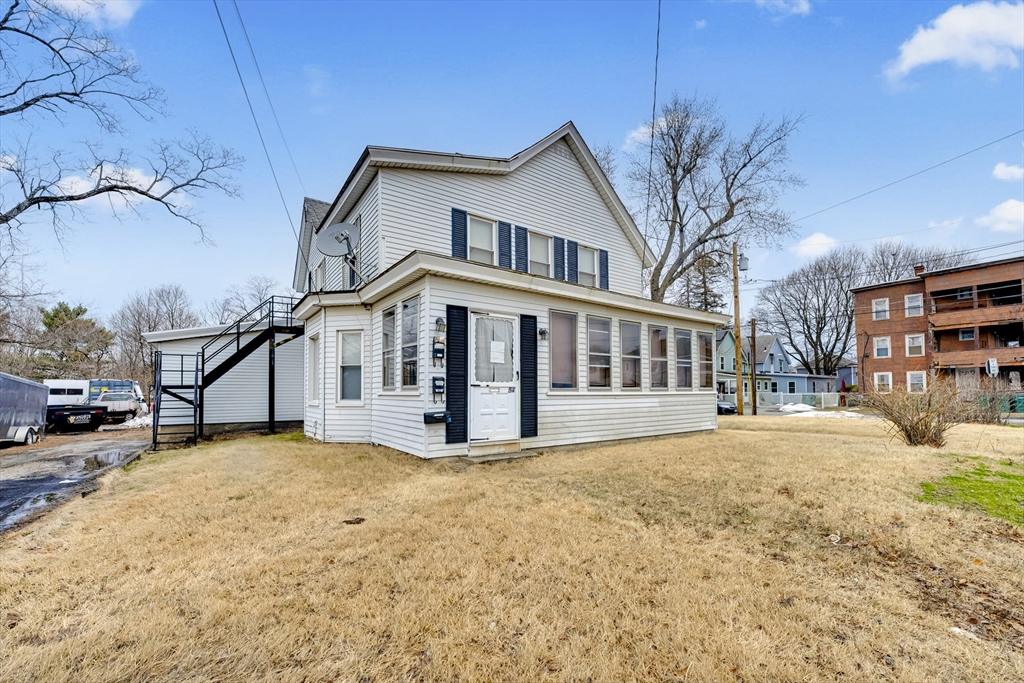 54 Airport Road Fitchburg, MA 01420 - Photo 25 of 38 a view of a house with a large tree in front of it