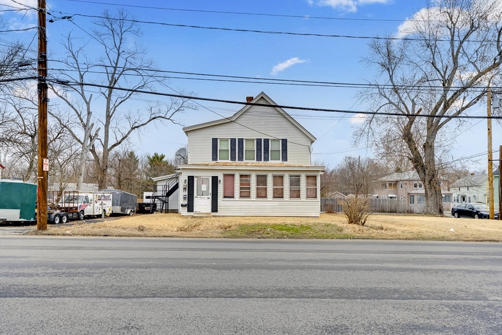 54 Airport Road Fitchburg, MA 01420 - Photo 26 of 38 a front view of a building with trees and buildings