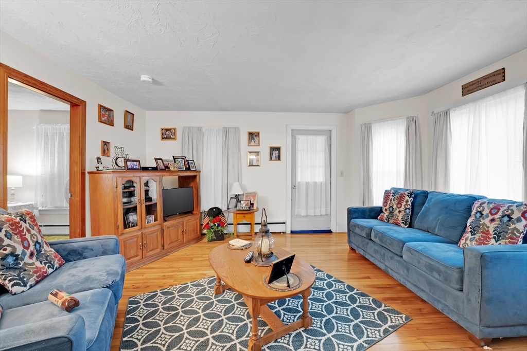 54 Airport Road Fitchburg, MA 01420 - Photo 6 of 38 a living room with furniture and wooden floor