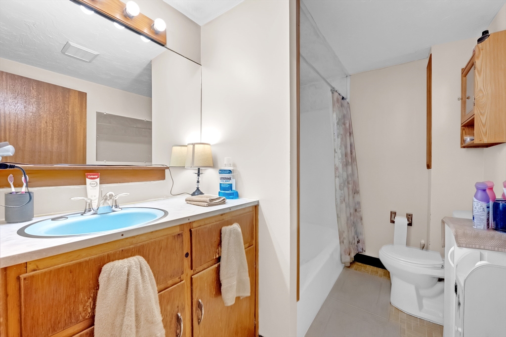 54 Airport Road Fitchburg, MA 01420 - Photo 8 of 38 a bathroom with a sink and a mirror
