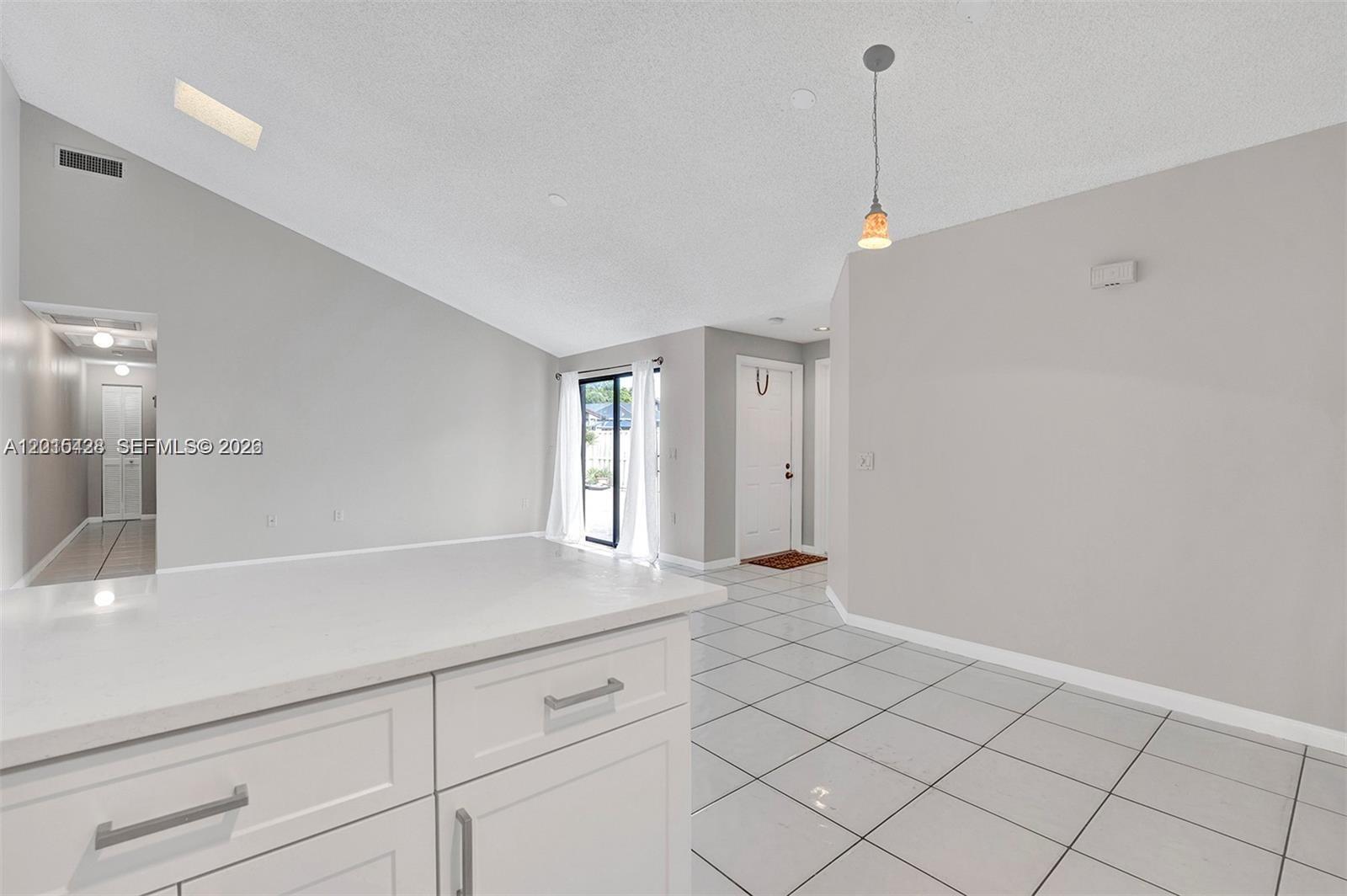 9892 Boca Gardens Parkway, Unit A Boca Raton, FL 33496 - Photo 11 of 32 a view of an empty room and window