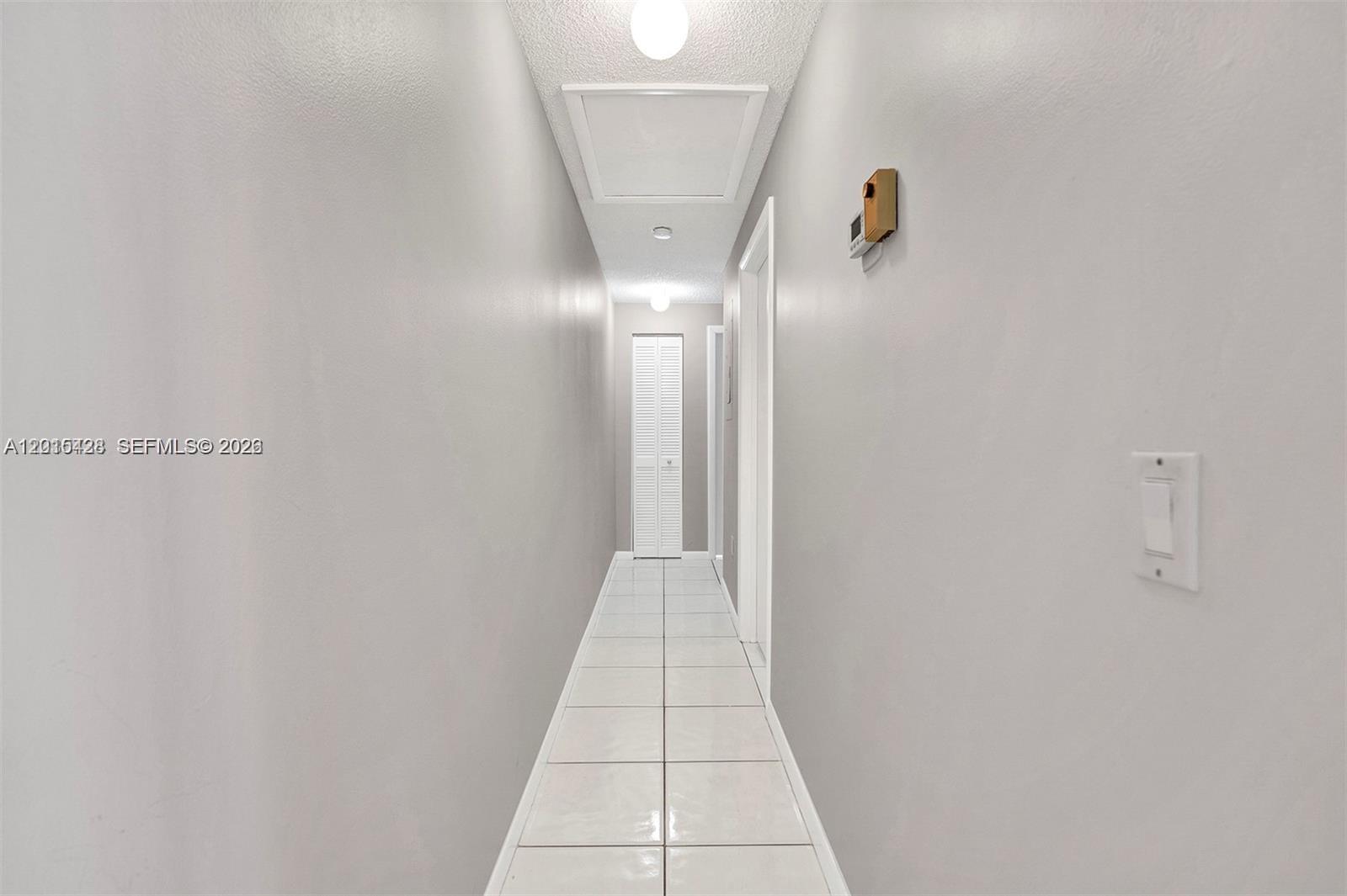 9892 Boca Gardens Parkway, Unit A Boca Raton, FL 33496 - Photo 13 of 32 a view of a hallway