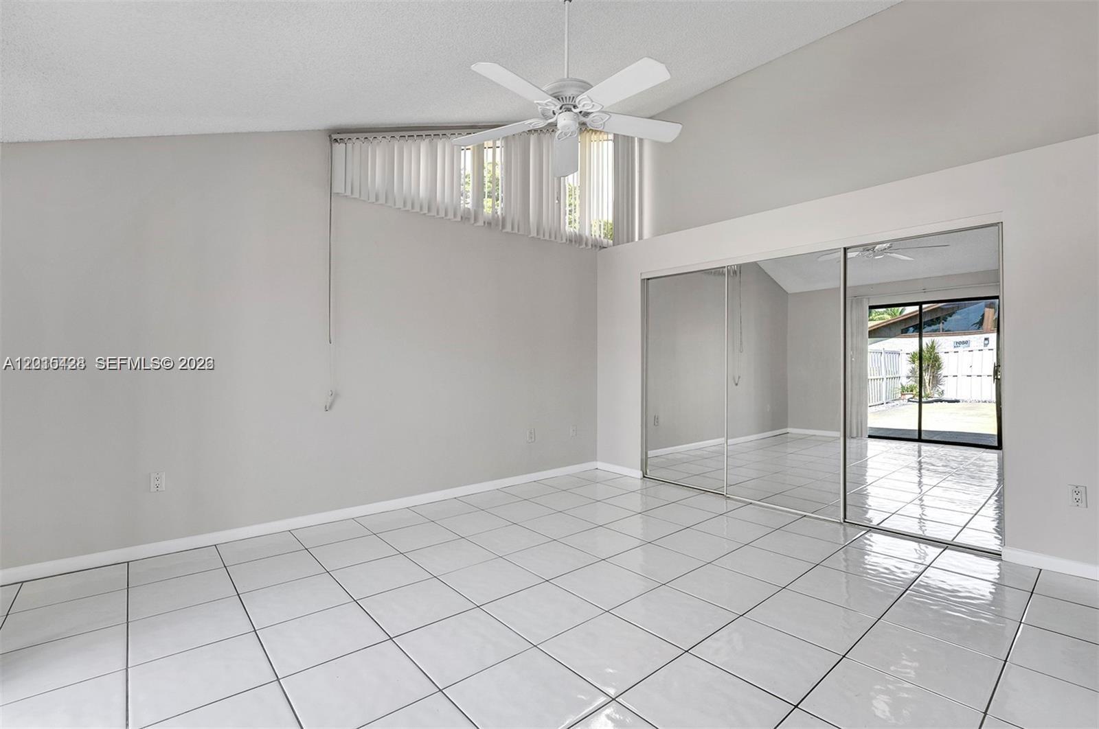9892 Boca Gardens Parkway, Unit A Boca Raton, FL 33496 - Photo 16 of 32 a view of an empty room and window
