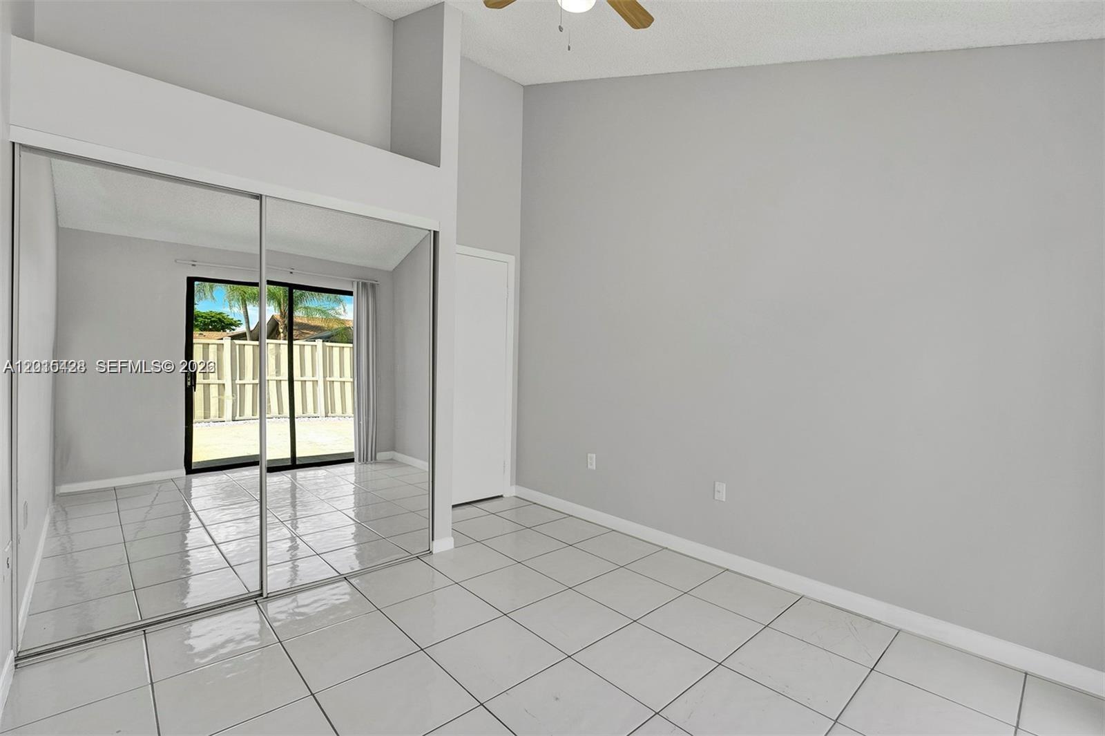 9892 Boca Gardens Parkway, Unit A Boca Raton, FL 33496 - Photo 24 of 32 a view of an empty room and window in a room