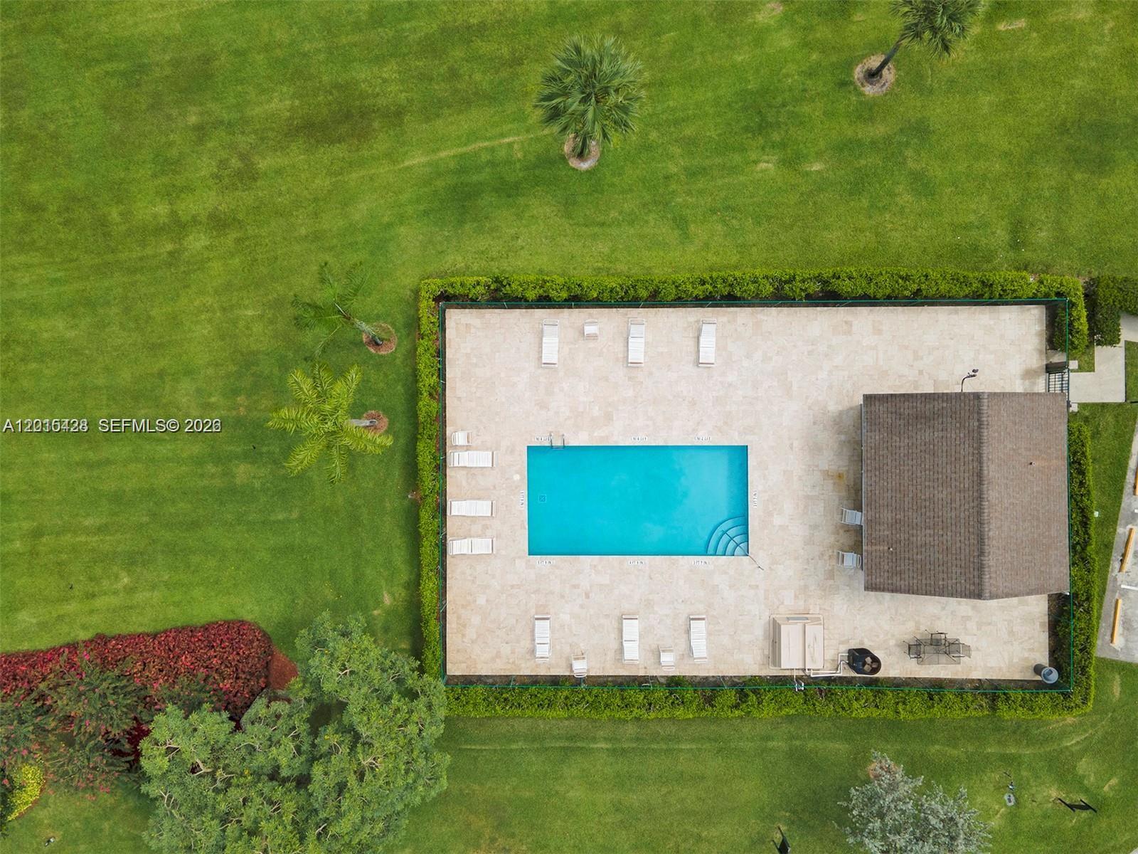 9892 Boca Gardens Parkway, Unit A Boca Raton, FL 33496 - Photo 26 of 32 a view of a garden with a small yard
