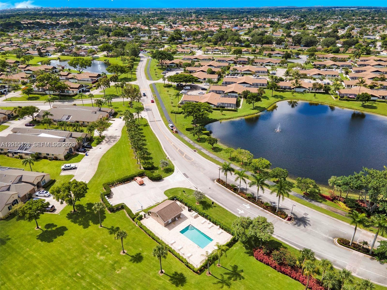 9892 Boca Gardens Parkway, Unit A Boca Raton, FL 33496 - Photo 27 of 32 an aerial view of residential houses with outdoor space