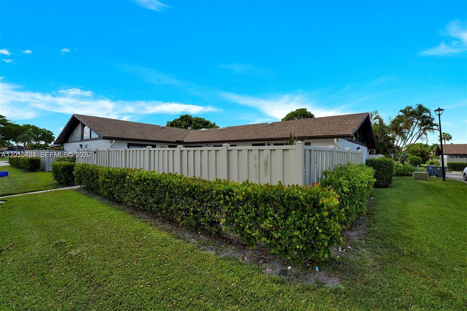 9892 Boca Gardens Parkway, Unit A Boca Raton, FL 33496 - Photo 32 of 32 a view of a back yard