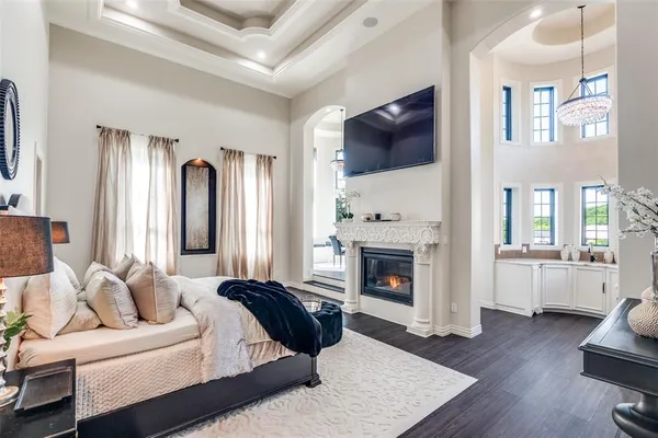 a living room with furniture fireplace and flat screen tv