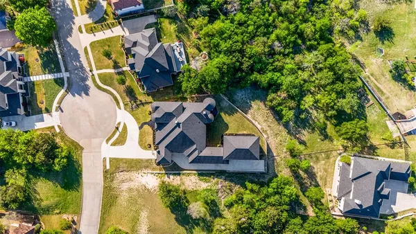 an aerial view of residential house with outdoor space and swimming pool