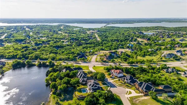a view of a city with lush green forest