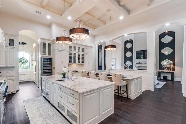 a bathroom with a sink a vanity and a large mirror
