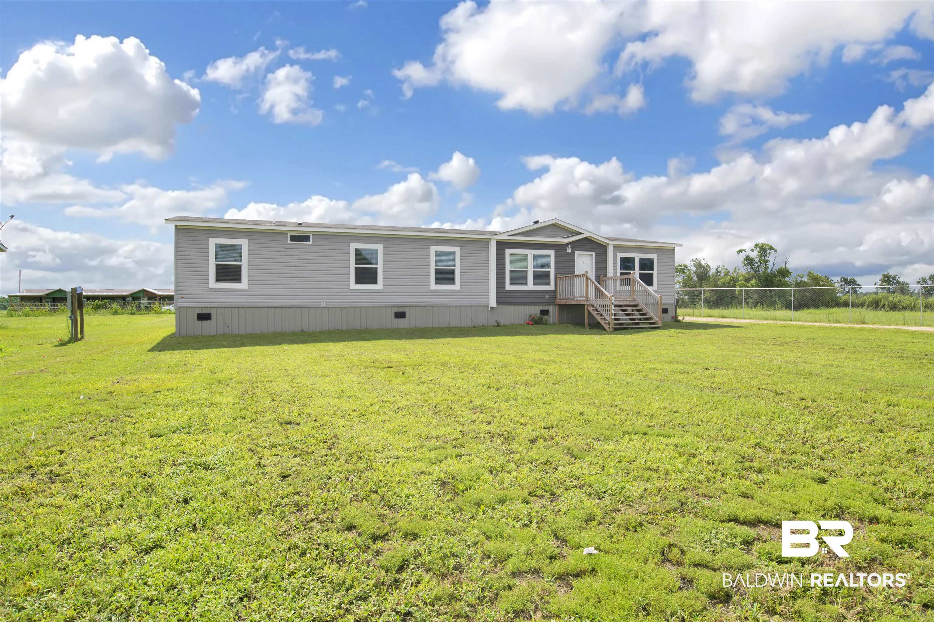 16778 County Road 87 Elberta, AL 36530 - Photo 1 of 32 Exterior space featuring a front lawn