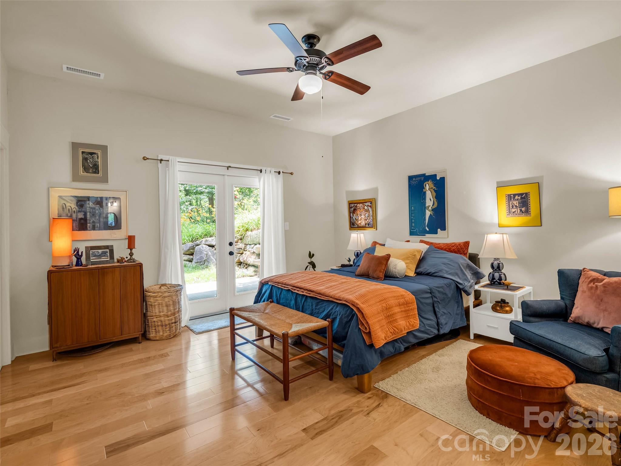 120 Glenn Court Mill Spring, NC 28756 - Photo 34 of 48 a spacious bedroom with two beds and a couch