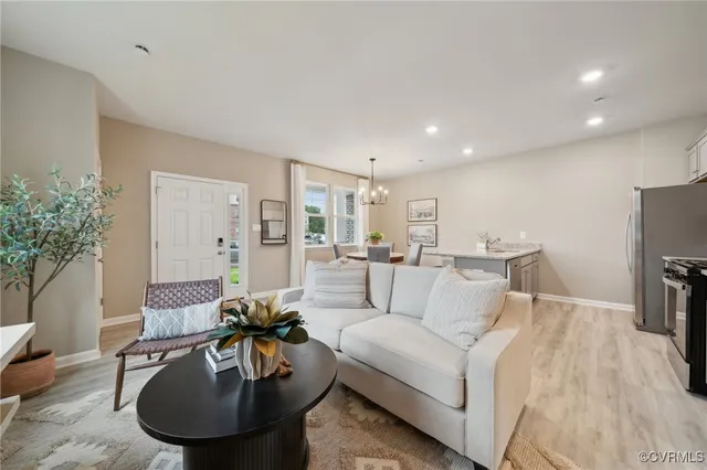 a living room with furniture and a fireplace