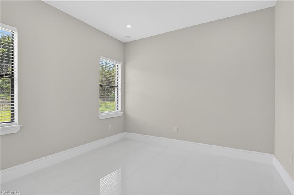 563 15th Street Northwest Naples, FL 34120 - Photo 12 of 22 a view of an empty room with a window