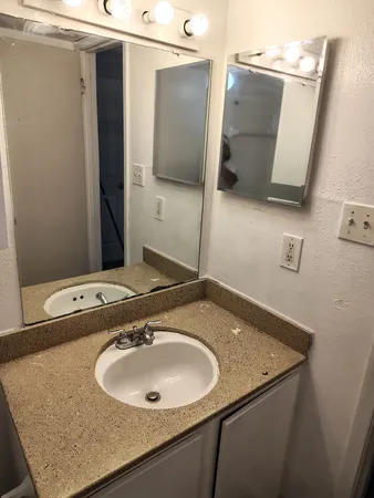 a view of a room with shelf on the wall