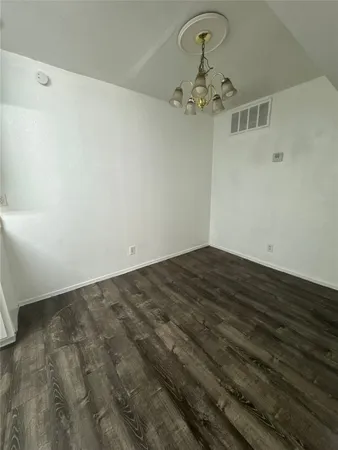 a view of a livingroom with a chandelier fan